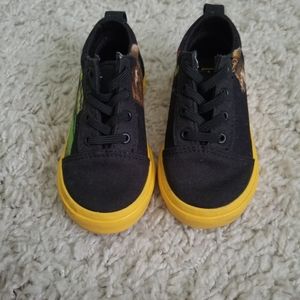 Vans toddler size 7. Black with yellow sole. National Geographic x Vans